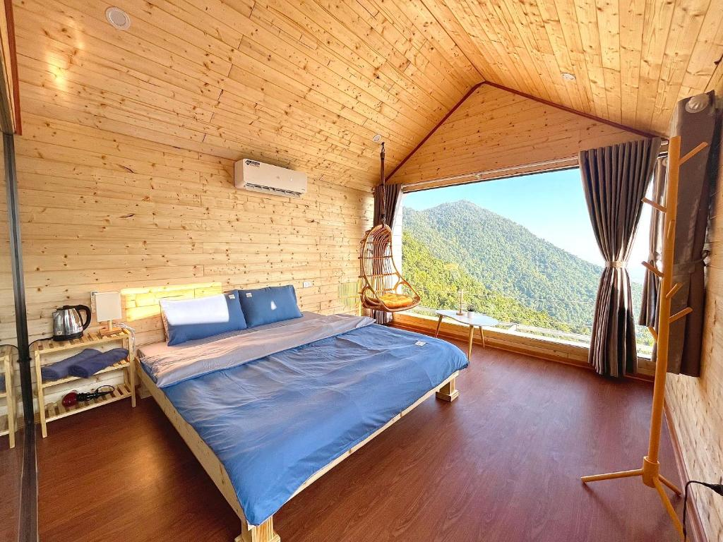 Cozy wooden chalet bedroom with mountain view